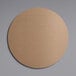 A white circular corrugated cake board.