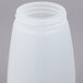 A Tablecraft polypropylene syrup dispenser with a brown lid.