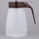 A Tablecraft polypropylene syrup dispenser with a brown top and handle.