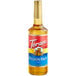 A Torani Passion Fruit syrup bottle with a label.