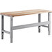 A wooden Lavex workbench with metal legs.