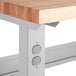 A close up of a Lavex heavy-duty industrial workbench with a square edge maple top.