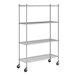 A chrome wire shelving unit with four shelves, tall posts, and caster wheels for mobility.