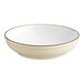 An Acopa cream white stoneware pasta bowl with a black rim.