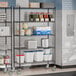 Steelton black metal wire shelving in a school kitchen with food on it.