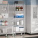 Steelton chrome wire shelving with casters in a kitchen with food items on the shelves.