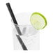 A glass of water with a lime slice and a Greenprint black straw.