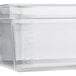 A Vigor translucent polypropylene food pan on a counter.