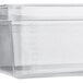 A Vigor translucent polypropylene food pan on a counter.