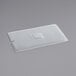 A translucent polypropylene plastic lid with a square hole in it.