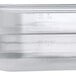 A close-up of a translucent Vigor polypropylene food pan.