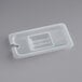 A translucent plastic lid with a rectangular notch for a plastic food container.