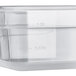 A Vigor translucent polypropylene food pan with a clear lid.