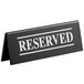 A black Tablecraft plastic "Reserved" sign with white text on both sides.