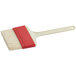 A Choice natural bristle pastry and basting brush with a white handle and red tip.