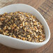 A bowl of ground spices on a table.