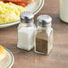 A close-up of a paneled salt shaker.