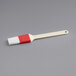 A white and red Choice pastry and basting brush with a plastic handle.