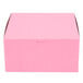 A pink bakery box with a lid.