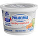 A white and blue Philadelphia Garden Vegetable Cream Cheese spread tub.