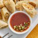 A plate of fried egg rolls with Ashoka Tango Mango dipping sauce.