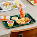 A forest green Choice right handed 6 compartment tray with food and drinks on it.