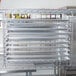 Metro chrome tray slides on a Metro rack holding trays.