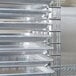 A stack of metal trays on Metro chrome tray slides.