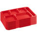 A stack of 12 red Choice heavy-duty melamine 6 compartment trays.