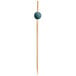 A Front of the House bamboo food pick with a blue ball on the end.