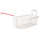 A wire fryer basket with a red handle.