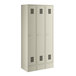 A beige metal Regency locker with three doors.