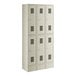 A beige Regency 2 tier locker with 3 wide sections and 6 doors.