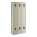 A beige metal Regency locker with three doors.