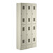 A group of white Regency Space Solutions metal lockers with twelve doors.