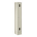 A beige metal locker with a door on it.