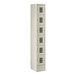 A beige metal Regency locker with six compartments.