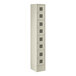A beige metal Regency locker with four compartments.