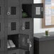 A black Regency 3-wide locker with 6 tiers and a door open to reveal shelves with shoes inside.