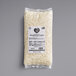 A white package of Follow Your Heart Dairy-Free Vegan Shredded Mozzarella Cheese with black text.