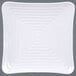 A white square plate with spiral pattern.
