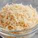 A bowl of Follow Your Heart Dairy-Free Vegan Shredded Parmesan Cheese.