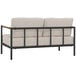 A white loveseat with a black metal frame and teak accents.