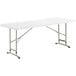 A white rectangular Lancaster Table & Seating plastic folding table with metal legs.