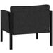 A black chair with a black frame and storage pockets on the arm rests.