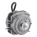 An Avantco condenser fan motor with black wires and a black cover over a grey metal device.