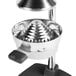 A silver stainless steel cone for a Choice Manual Juicer on a metal stand.