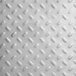 A white metal surface with small holes on a metal plate.