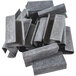 A pile of gray metal Lavex micro-grit seals.