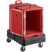 A red plastic CaterGator food pan carrier on a black dolly with a door open.